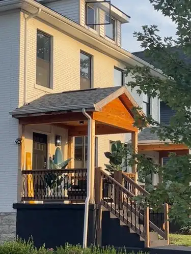 An inviting porch catches the beautiful golden light.